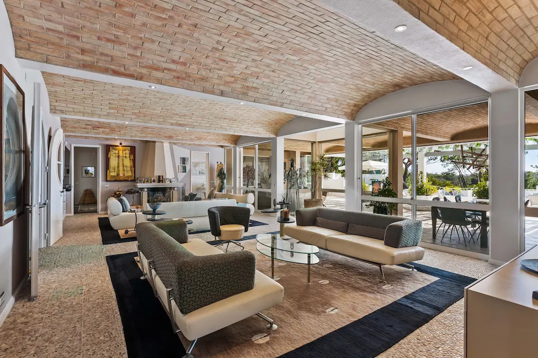 Indoor outdoor lounge area connecting interior and terrace at Casa Estrela
