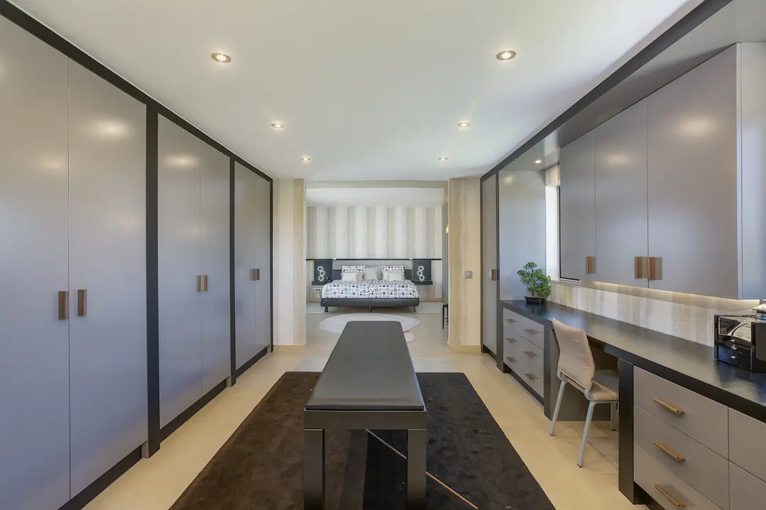 Elegant walk-in closet with custom storage inside Casa Harmonia luxury villa Algarve