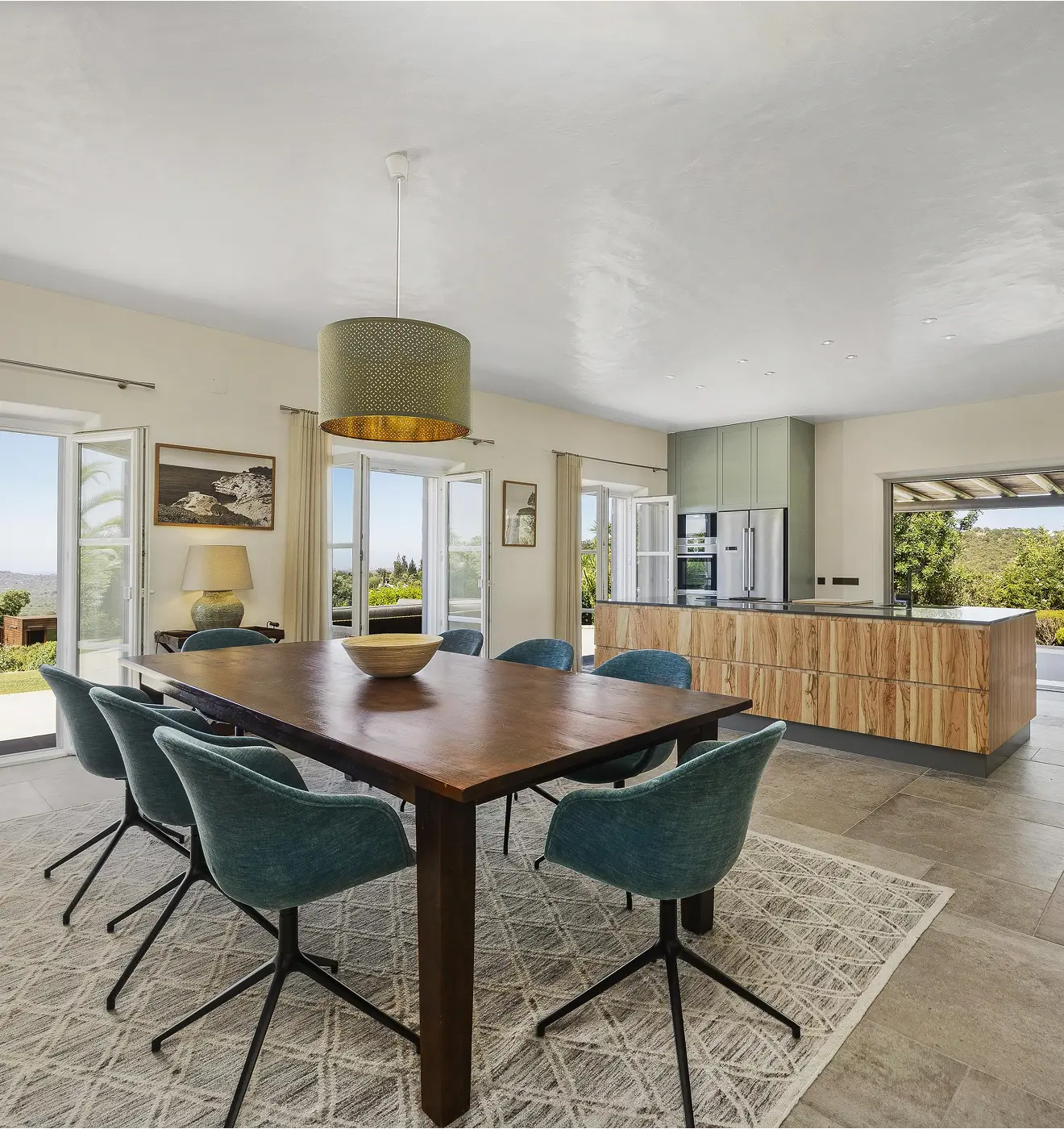 Modern dining area with stone island designed for entertaining in Villa Alegria Algarve
